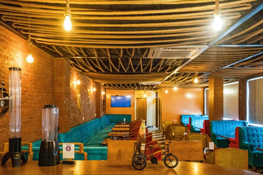 Warm and stylish restaurant lounge with cosy seating and ambient lighting